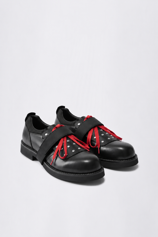 GR10K STUDDED ASPHALT DERBY II IN BLACK