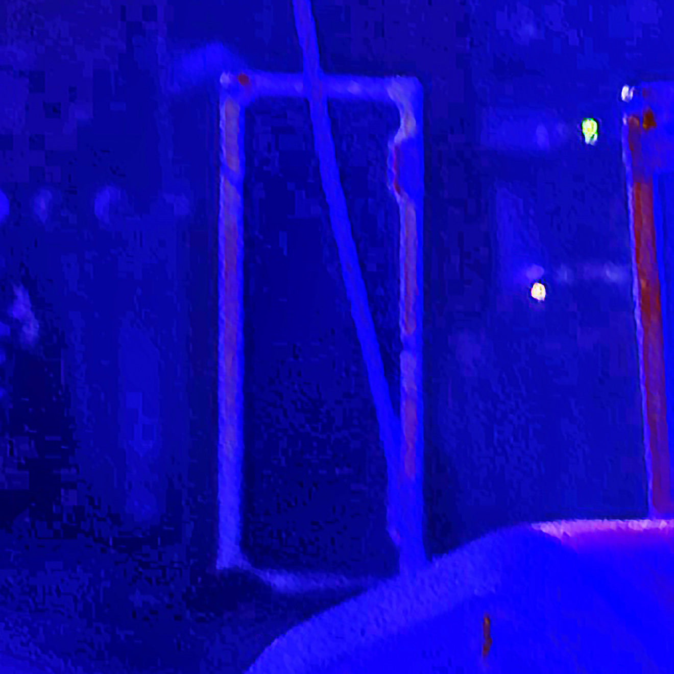 A low-resolution, heavily blue-tinted image showing during Kim Gordon Performance at FW:B music festival